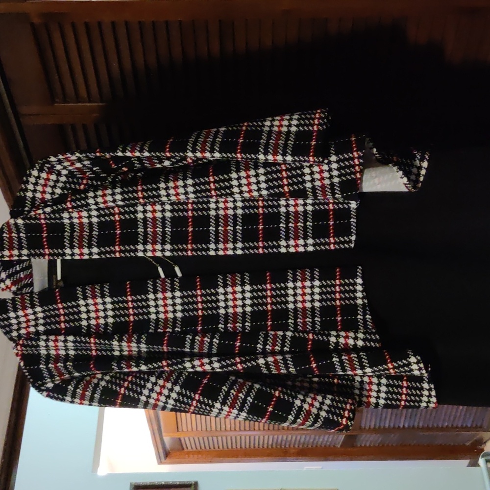 Houndstooth print jacket with black dress